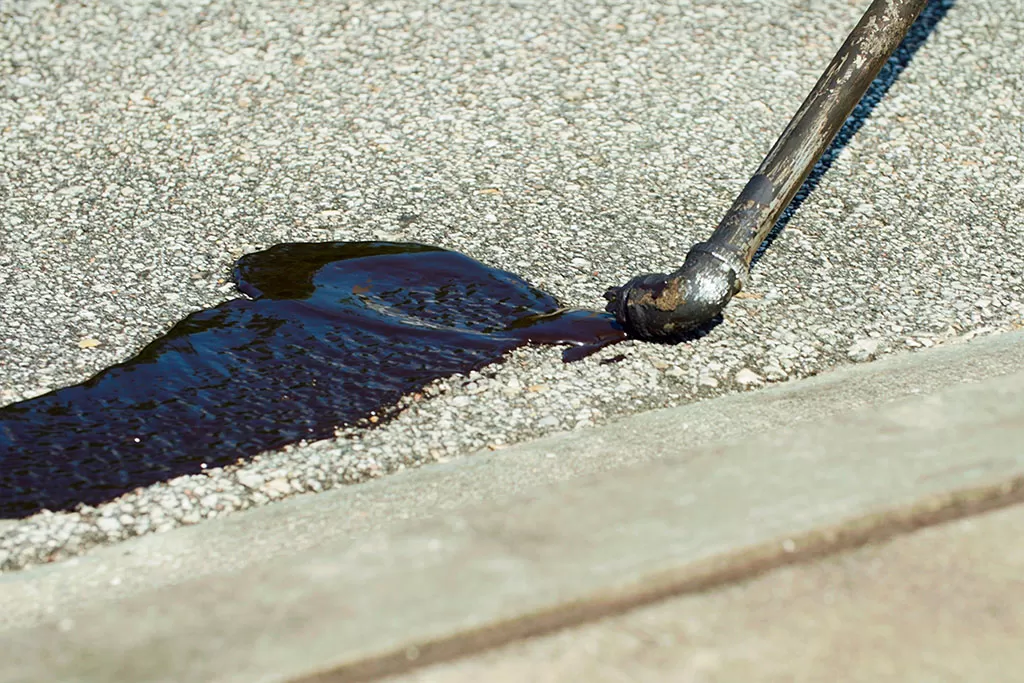 Crack seal application on asphalt